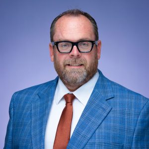 headshot of Brandon Booher, Director of Education